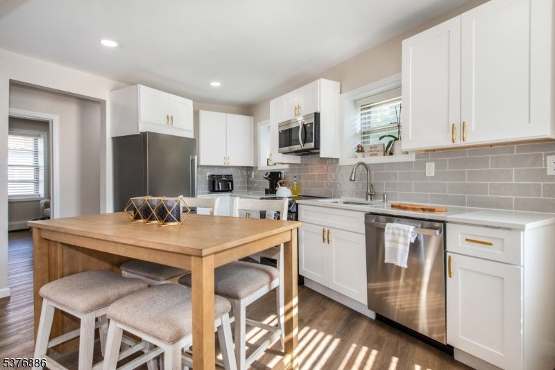 Dining room, Interior, Kitchen, Recessed Lighting, Stainless Steel Appliances, Wood Texture Flooring
