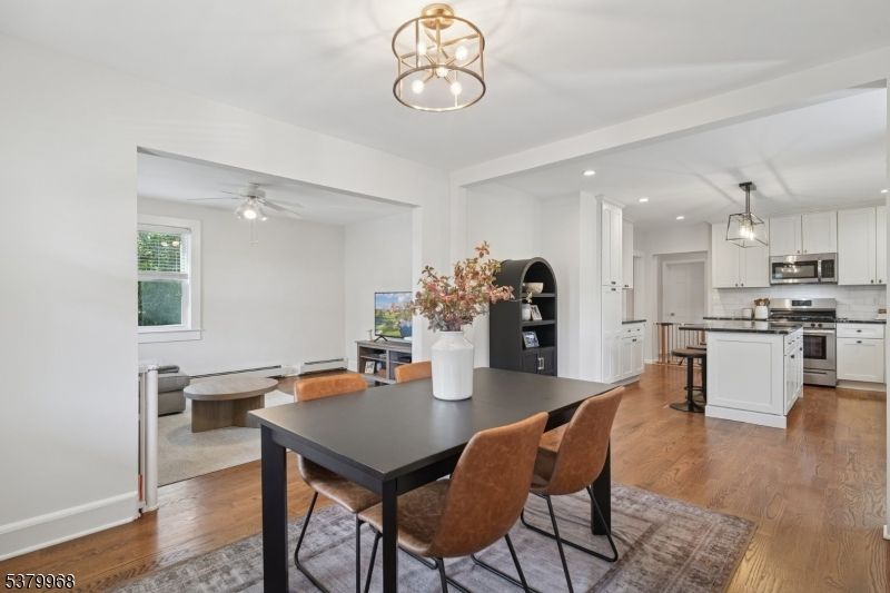 Dining room, Interior, Kitchen, Pendant Lights, Recessed Lighting, Stainless Steel Appliances, Wood Texture Flooring