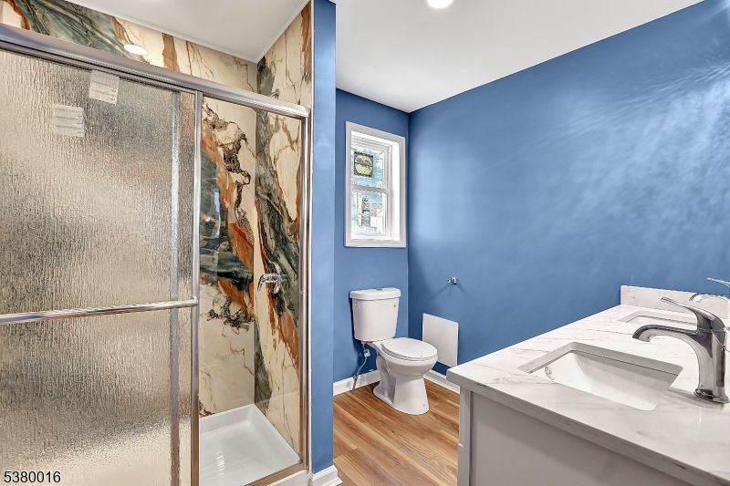 Bathroom, Glass Shower, Interior, Marble Walls, Recessed Lighting, Wood Texture Flooring