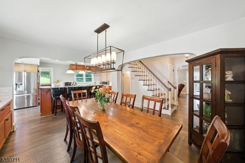 Chandelier, Dining room, Interior, Kitchen, Pendant Lights, Recessed Lighting, Stainless Steel Appliances, Wood Texture Flooring