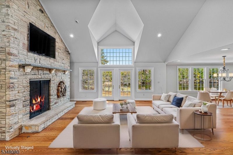 Chandelier, Dining room, Fireplace, Interior, Living room, Recessed Lighting, Stone Walls, Wood Texture Flooring
