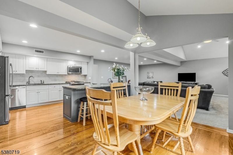 Dining room, Interior, Kitchen, Pendant Lights, Recessed Lighting, Stainless Steel Appliances, Wood Texture Flooring
