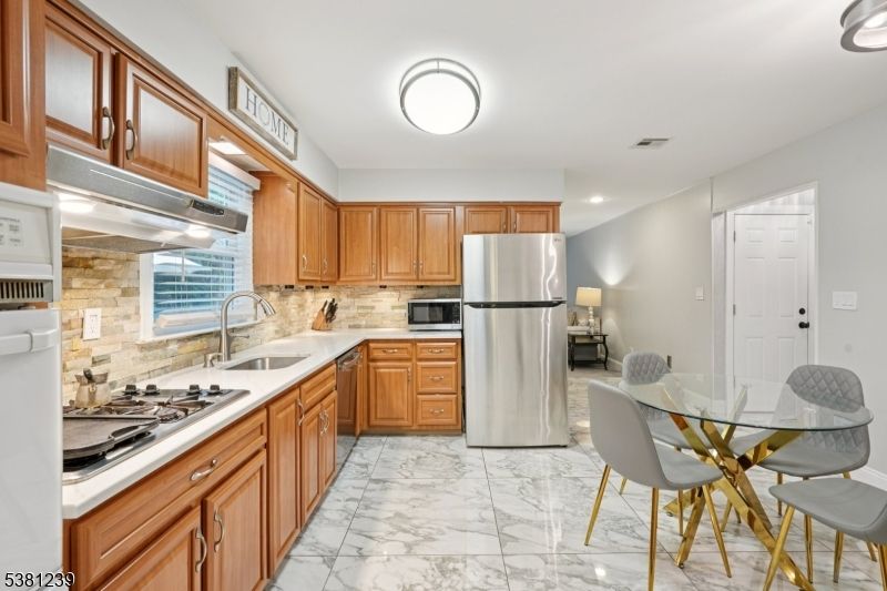 Dining room, Interior, Kitchen, Marble, Recessed Lighting, Stainless Steel Appliances, Stone Walls