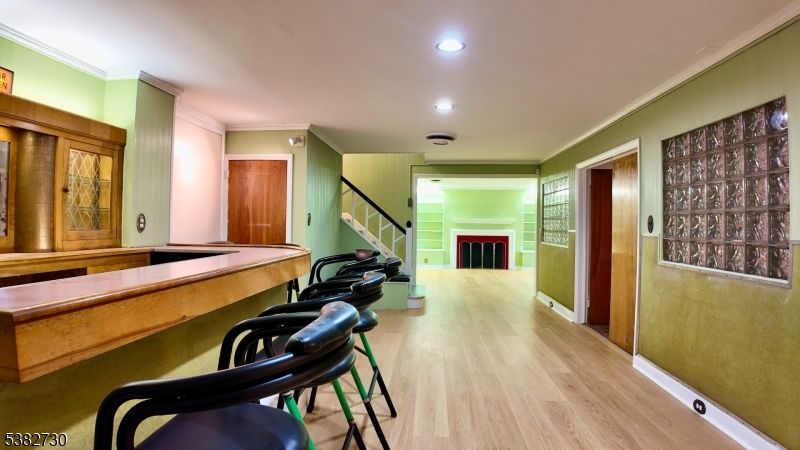 Fireplace, Game Room, Interior, Recessed Lighting, Wood Texture Flooring