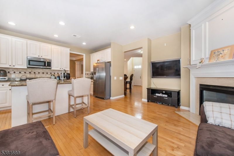 Fireplace, Interior, Kitchen, Recessed Lighting, Wood Texture Flooring