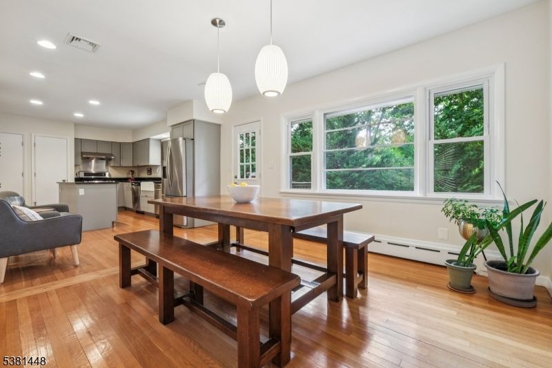 Dining room, Interior, Kitchen, Pendant Lights, Recessed Lighting, Stainless Steel Appliances, Wood Texture Flooring