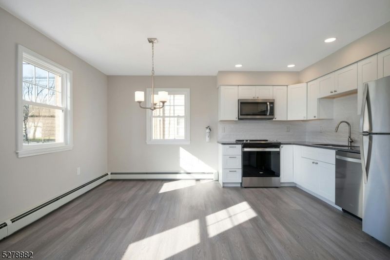 Chandelier, Interior, Kitchen, Pendant Lights, Recessed Lighting, Stainless Steel Appliances, Wood Texture Flooring