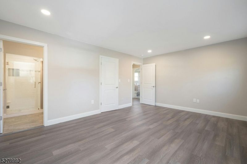 Bathroom, Empty room, Glass Shower, Interior, Recessed Lighting, Wood Texture Flooring