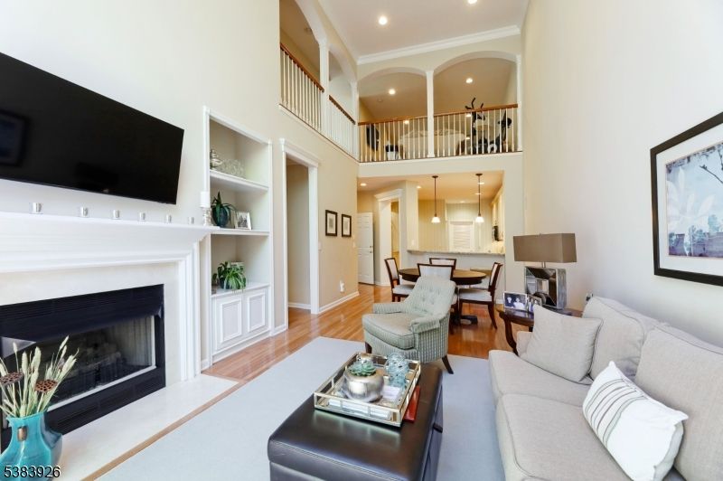 Dining room, Fireplace, Interior, Living room, Recessed Lighting, Wood Texture Flooring