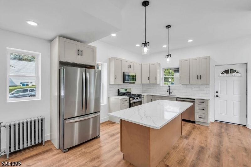 Interior, Kitchen, Pendant Lights, Recessed Lighting, Stainless Steel Appliances, Wood Texture Flooring