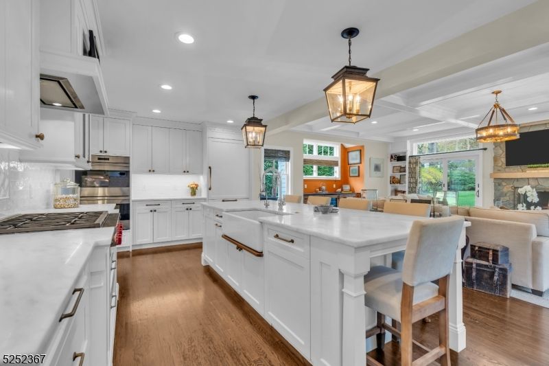 Dining room, Fireplace, Interior, Kitchen, Living room, Pendant Lights, Recessed Lighting, Stainless Steel Appliances, Wood Texture Flooring