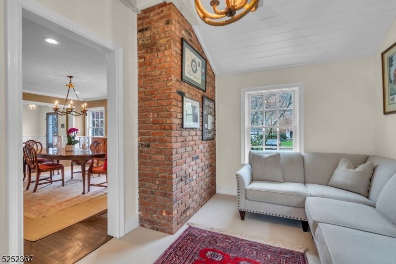 Chandelier, Dining room, Interior, Living room, Recessed Lighting, Stone Walls, Wood Texture Flooring