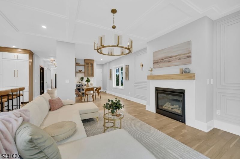 Chandelier, Dining room, Fireplace, Interior, Living room, Pendant Lights, Recessed Lighting, Wood Texture Flooring