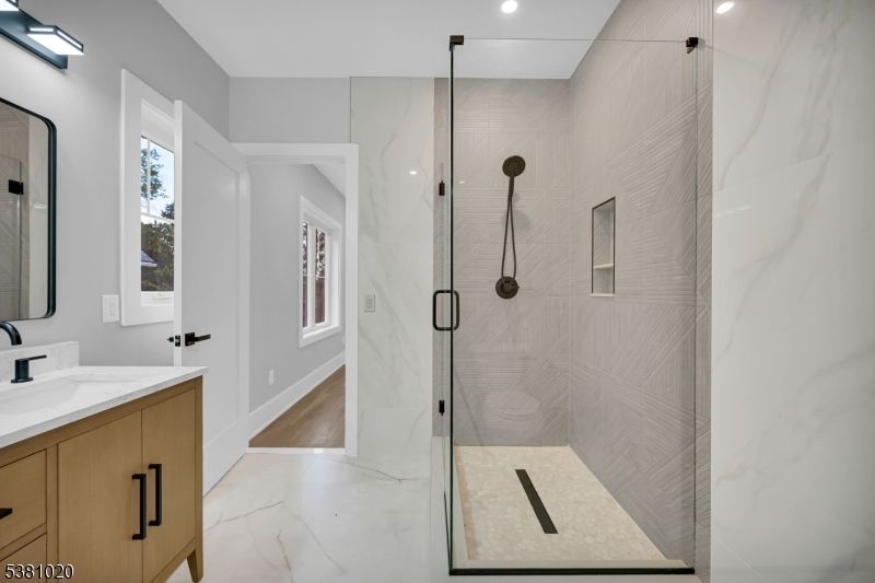 Bathroom, Glass Shower, Interior, Marble, Marble Walls, Recessed Lighting, Wood Texture Flooring
