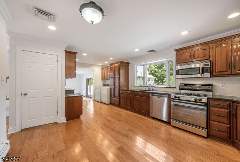 Interior, Kitchen, Recessed Lighting, Stainless Steel Appliances, Wood Texture Flooring