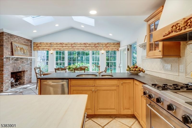 Dining room, Fireplace, Interior, Kitchen, Pendant Lights, Recessed Lighting, Stainless Steel Appliances, Stone Walls