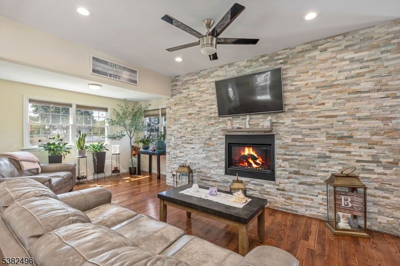 Fireplace, Interior, Living room, Recessed Lighting, Stone Walls, Wood Texture Flooring