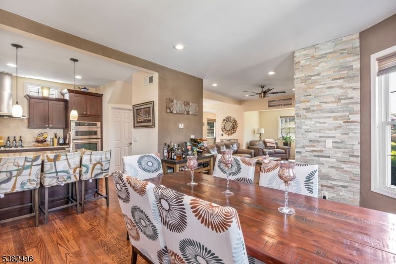 Dining room, Interior, Kitchen, Living room, Pendant Lights, Recessed Lighting, Stainless Steel Appliances, Stone Walls, Wood Texture Flooring