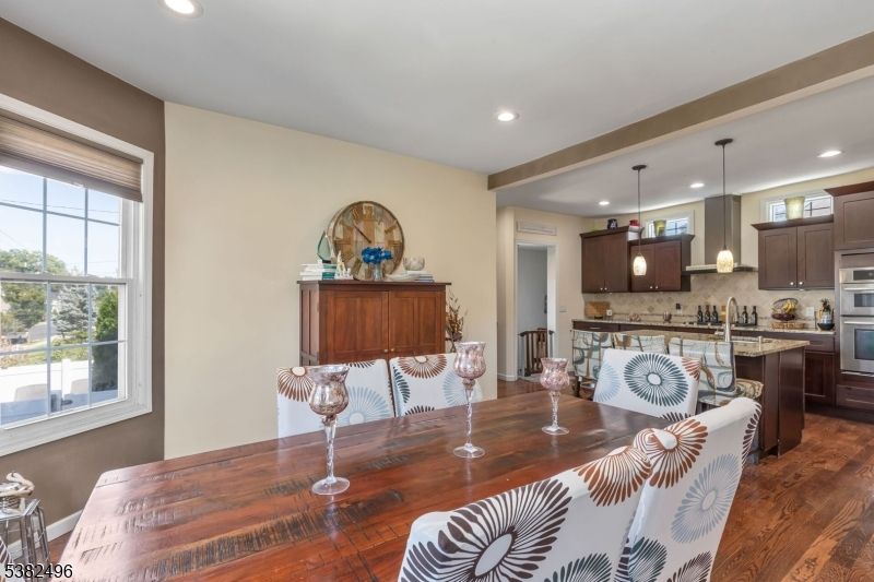 Dining room, Interior, Kitchen, Pendant Lights, Recessed Lighting, Stainless Steel Appliances, Wood Texture Flooring