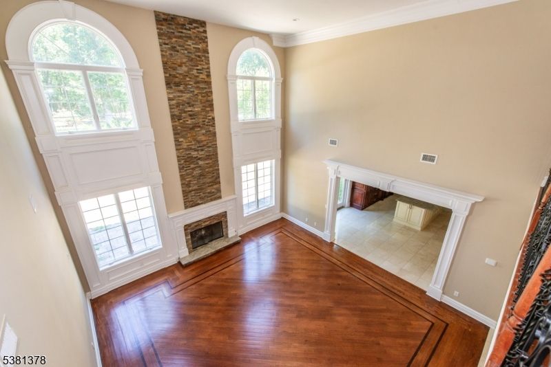 Empty room, Fireplace, Interior, Recessed Lighting, Stone Walls, Wood Texture Flooring