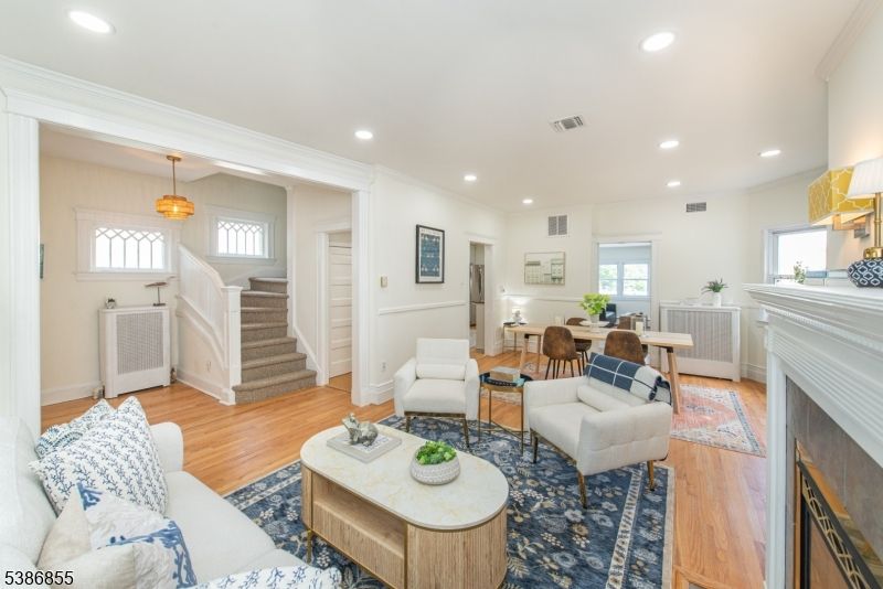 Dining room, Fireplace, Interior, Living room, Pendant Lights, Recessed Lighting, Wood Texture Flooring