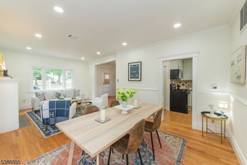 Dining room, Fireplace, Interior, Living room, Recessed Lighting, Wood Texture Flooring