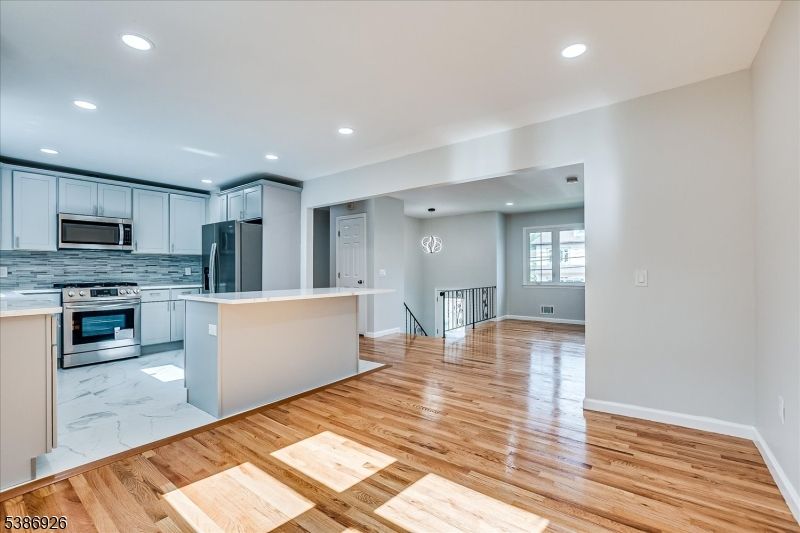 Interior, Kitchen, Marble, Recessed Lighting, Stainless Steel Appliances, Wood Texture Flooring