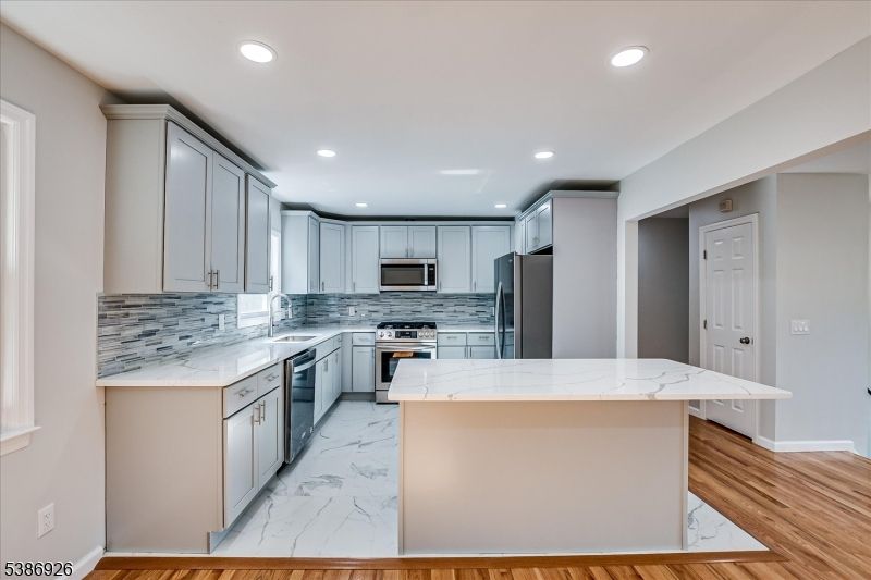 Interior, Kitchen, Marble, Recessed Lighting, Stainless Steel Appliances, Wood Texture Flooring