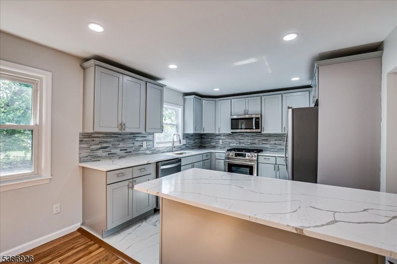 Interior, Kitchen, Marble, Recessed Lighting, Stainless Steel Appliances, Wood Texture Flooring