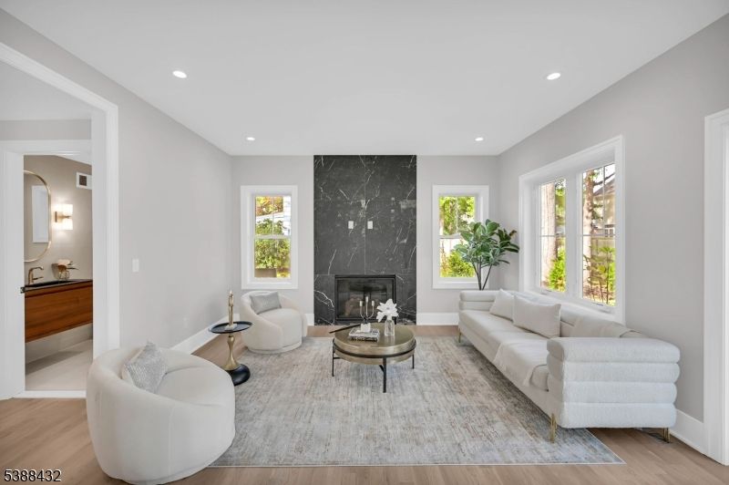 Fireplace, Interior, Living room, Marble Walls, Recessed Lighting, Wood Texture Flooring