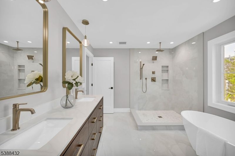 Bathroom, Dual Sink Vanities, Free Standing Baths, Glass Shower, Interior, Marble Walls, Pendant Lights, Recessed Lighting