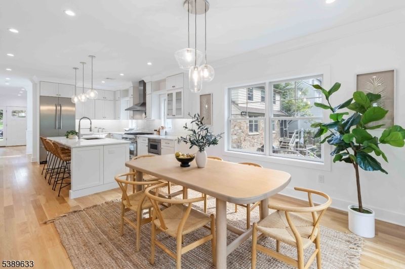 Dining room, Interior, Kitchen, Pendant Lights, Recessed Lighting, Stainless Steel Appliances, Wood Texture Flooring
