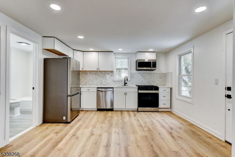 Interior, Kitchen, Recessed Lighting, Stainless Steel Appliances, Wood Texture Flooring