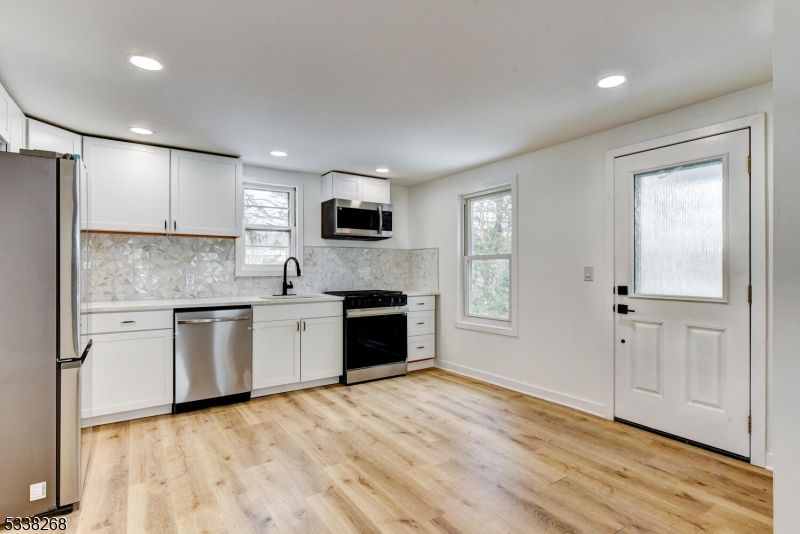 Interior, Kitchen, Recessed Lighting, Stainless Steel Appliances, Wood Texture Flooring