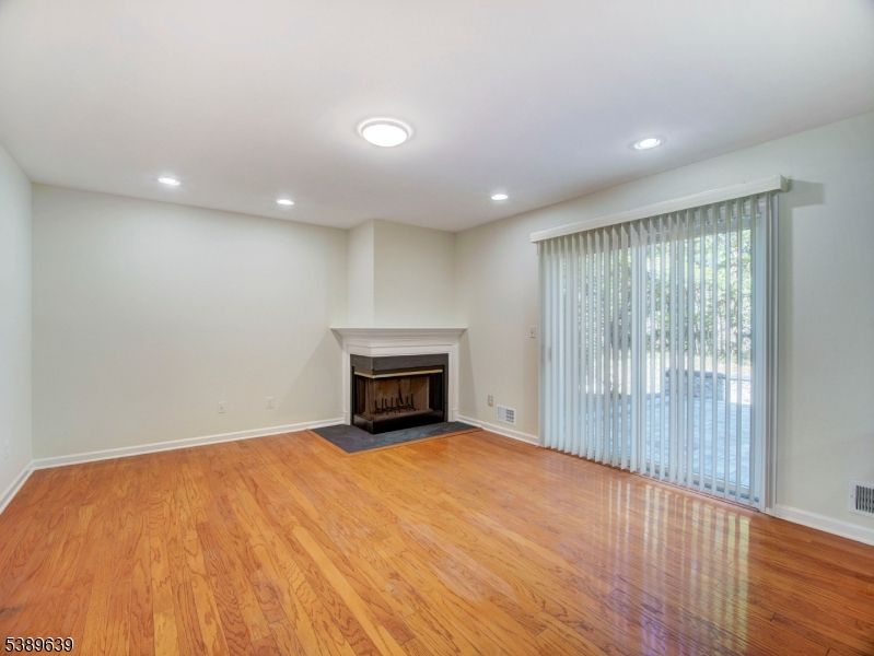 Empty room, Fireplace, Interior, Recessed Lighting, Wood Texture Flooring