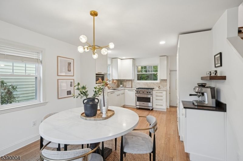 Dining room, Interior, Kitchen, Pendant Lights, Recessed Lighting, Stainless Steel Appliances, Wood Texture Flooring