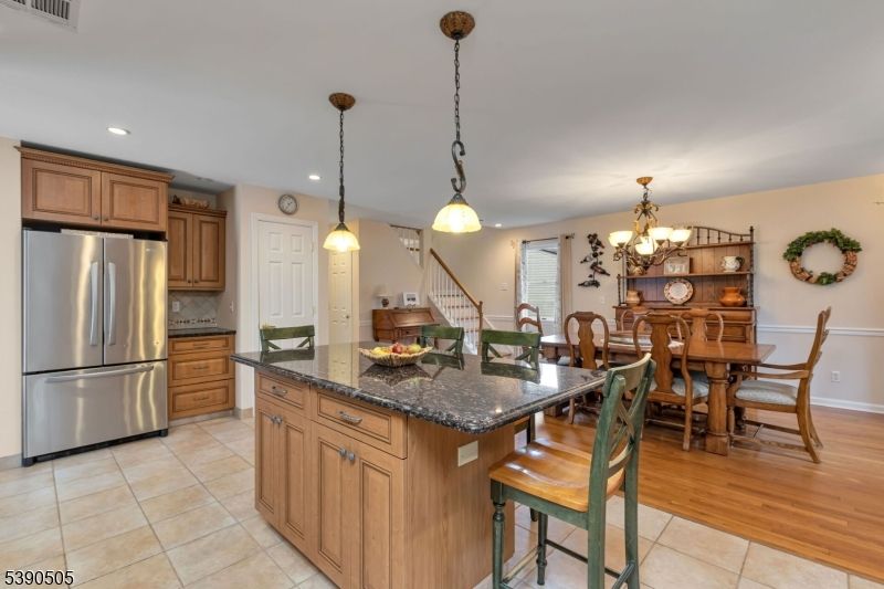 Chandelier, Dining room, Interior, Kitchen, Pendant Lights, Recessed Lighting, Stainless Steel Appliances, Wood Texture Flooring