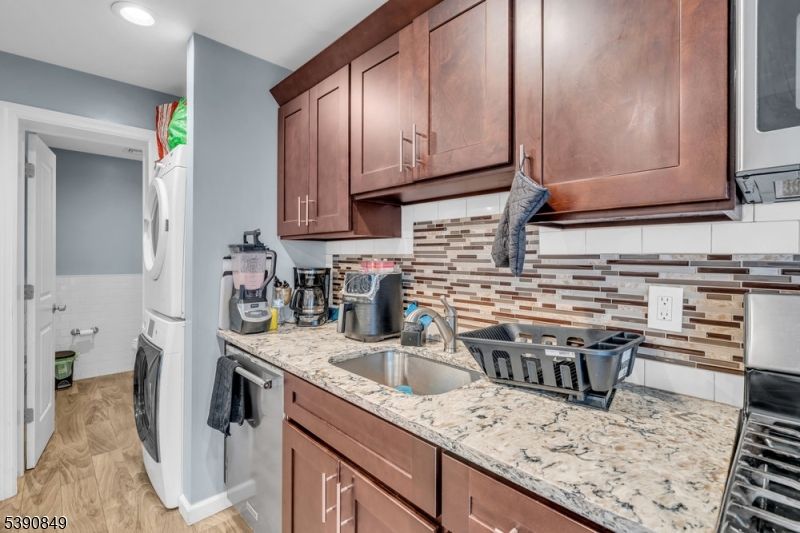 Interior, Kitchen, Recessed Lighting, Washer, Wood Texture Flooring