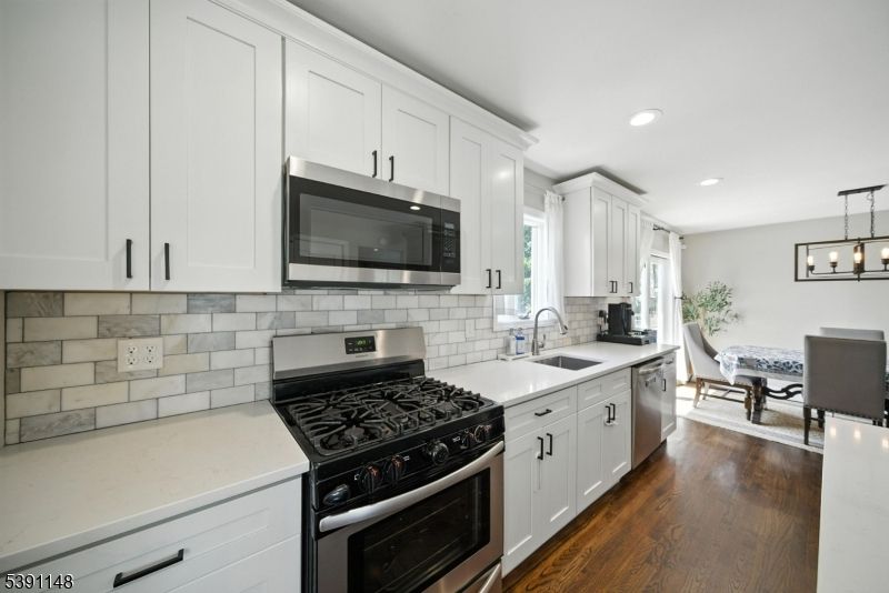 Dining room, Interior, Kitchen, Pendant Lights, Recessed Lighting, Stainless Steel Appliances, Wood Texture Flooring