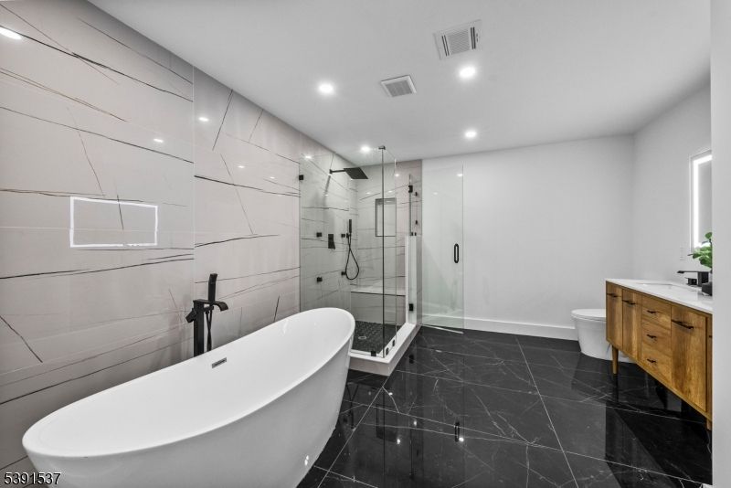 Bathroom, Free Standing Baths, Glass Shower, Interior, Marble, Marble Walls, Recessed Lighting