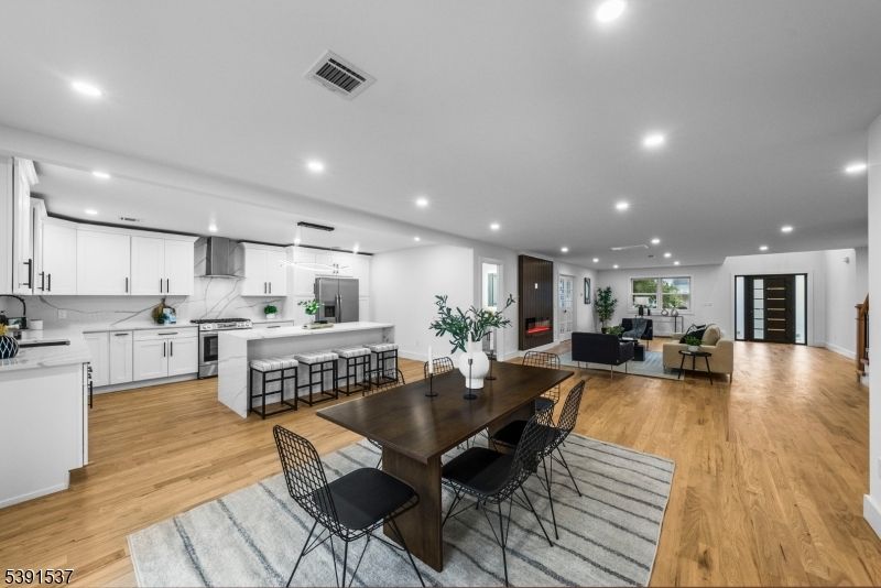 Dining room, Interior, Kitchen, Living room, Recessed Lighting, Stainless Steel Appliances, Wood Texture Flooring