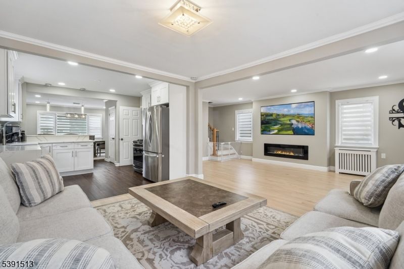 Fireplace, Interior, Kitchen, Living room, Recessed Lighting, Stainless Steel Appliances, Wood Texture Flooring