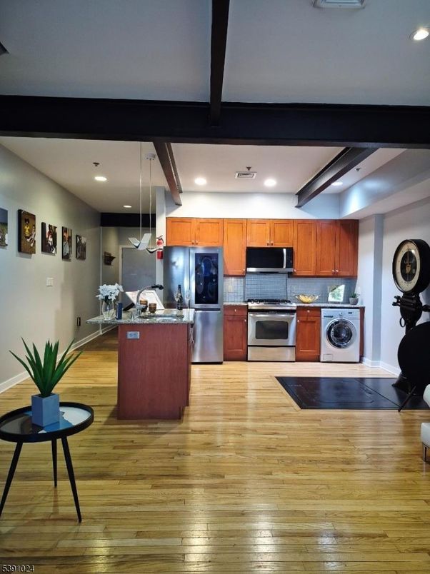 Interior, Kitchen, Recessed Lighting, Stainless Steel Appliances, Washer, Wood Texture Flooring