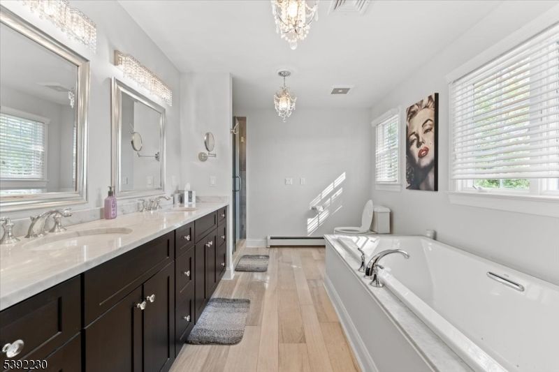 Bathroom, Chandelier, Dual Sink Vanities, Interior, Wood Texture Flooring