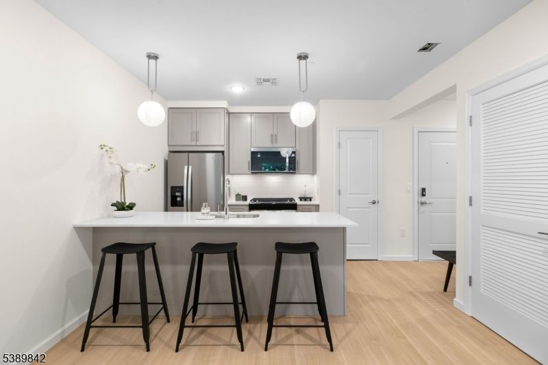 Interior, Kitchen, Pendant Lights, Recessed Lighting, Stainless Steel Appliances, Wood Texture Flooring