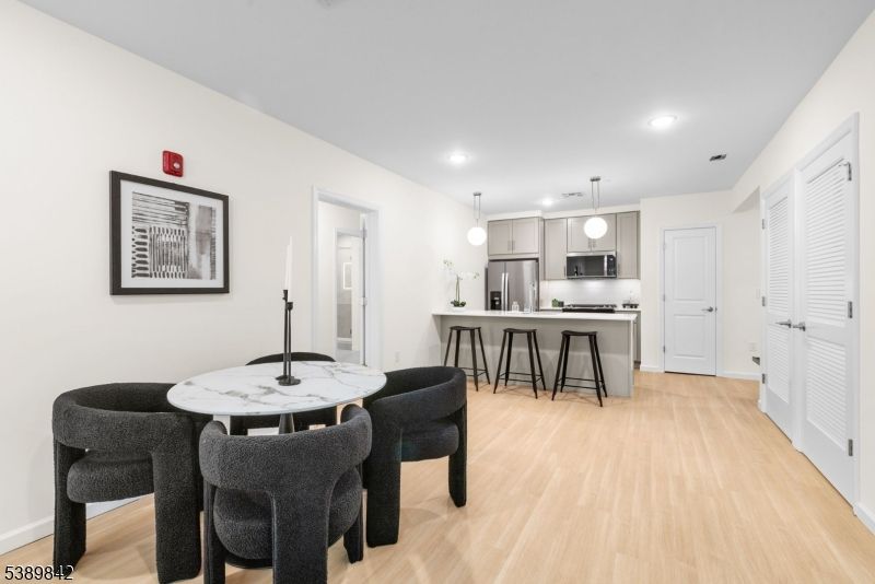 Dining room, Interior, Kitchen, Pendant Lights, Recessed Lighting, Stainless Steel Appliances, Wood Texture Flooring