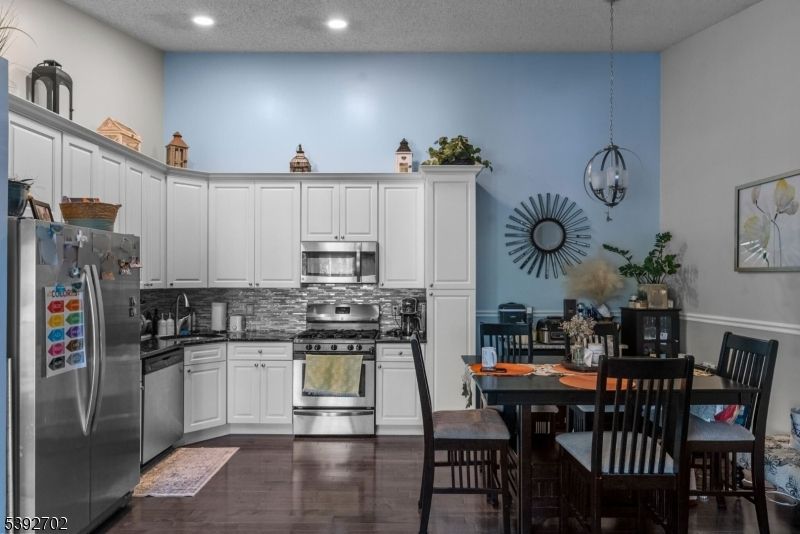 Dining room, Interior, Kitchen, Pendant Lights, Recessed Lighting, Stainless Steel Appliances, Wood Texture Flooring