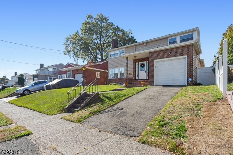 Attached, Exterior, Facade, Brick Facade, American Foursquare
