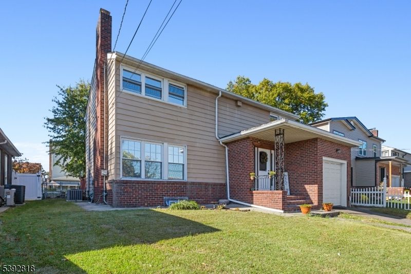 Attached, Backyard, Exterior, Facade, Brick Facade, Cape Cod