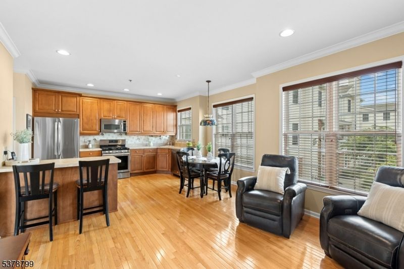 Dining room, Interior, Kitchen, Pendant Lights, Recessed Lighting, Stainless Steel Appliances, Wood Texture Flooring